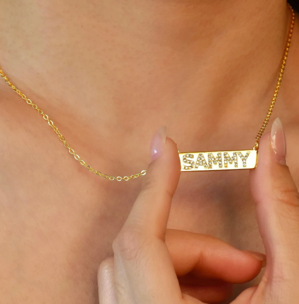 A delicate personalized bar necklace designed with custom lettering and subtle crystal accents. Minimalist, lightweight, and suitable for everyday wear or thoughtful gifting.