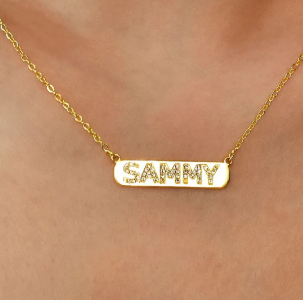 A delicate personalized bar necklace designed with custom lettering and subtle crystal accents. Minimalist, lightweight, and suitable for everyday wear or thoughtful gifting.